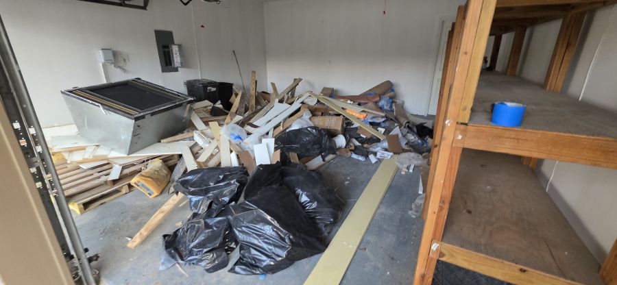 Garage with construction debris before cleanout